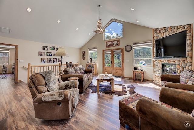 617 Mcclellan Creek Rd, Clancy, MT 59634 - living area featuring high vaulted ceiling, recessed lighting, wood finished floors, a fireplace, and baseboards