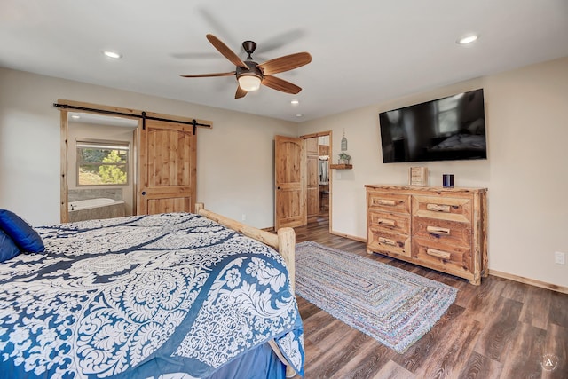 617 Mcclellan Creek Rd, Clancy, MT 59634 - bedroom featuring a barn door, wood finished floors, recessed lighting, and a ceiling fan