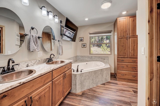617 Mcclellan Creek Rd, Clancy, MT 59634 - full bath featuring wood finished floors, a bath, and double vanity