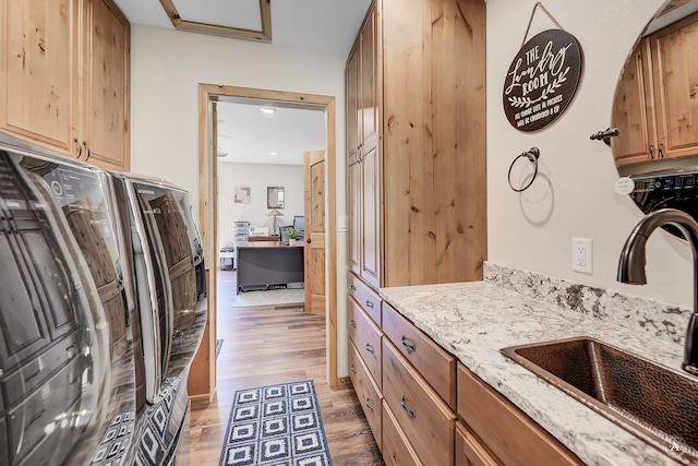 617 Mcclellan Creek Rd, Clancy, MT 59634 - laundry room with cabinet space, light wood-type flooring, washer and clothes dryer, and recessed lighting