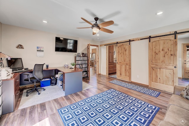 617 Mcclellan Creek Rd, Clancy, MT 59634 - office featuring a barn door, a ceiling fan, light wood-style flooring, and recessed lighting