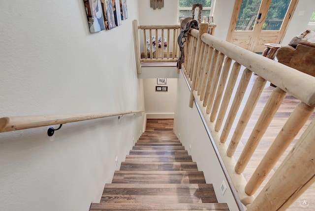 617 Mcclellan Creek Rd, Clancy, MT 59634 - staircase featuring wood finished floors and french doors