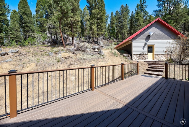 617 Mcclellan Creek Rd, Clancy, MT 59634 - wooden deck with view of wooded area
