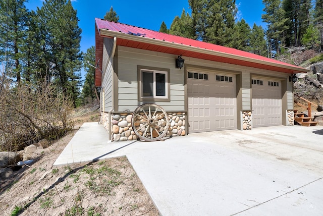 617 Mcclellan Creek Rd, Clancy, MT 59634 - view of home's exterior with metal roof and a garage