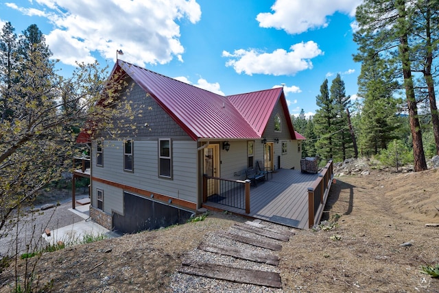 617 Mcclellan Creek Rd, Clancy, MT 59634 - rustic home featuring a deck, a standing seam roof, and metal roof