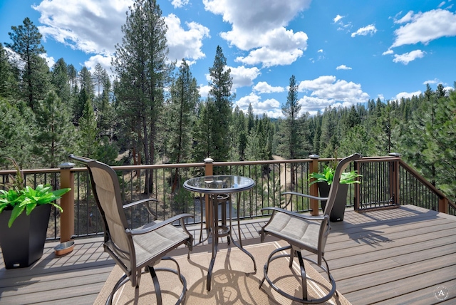 617 Mcclellan Creek Rd, Clancy, MT 59634 - wooden terrace featuring a forest view