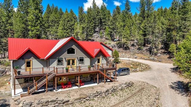 617 Mcclellan Creek Rd, Clancy, MT 59634 - back of house with stairway, a deck, and metal roof