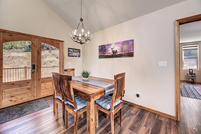 617 Mcclellan Creek Rd, Clancy, MT 59634 - dining space with a chandelier, dark wood-style flooring, vaulted ceiling, and baseboards