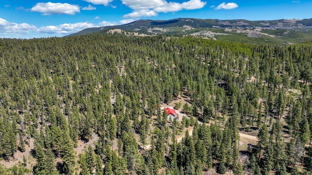 617 Mcclellan Creek Rd, Clancy, MT 59634 - aerial overview of property's location with a heavily wooded area and a mountainous background