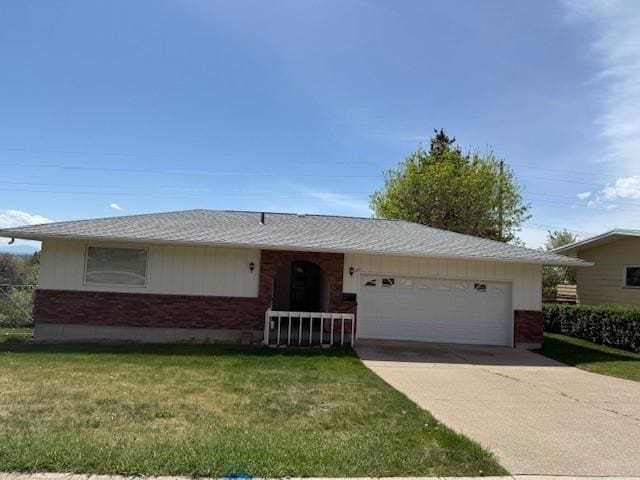 120 29th Ave NW, Great Falls, MT 59404 - single story home with brick siding, an attached garage, concrete driveway, and a front yard