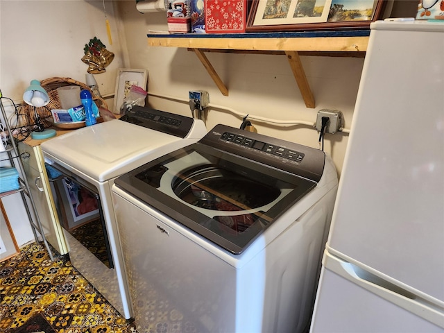 washroom with separate washer and dryer