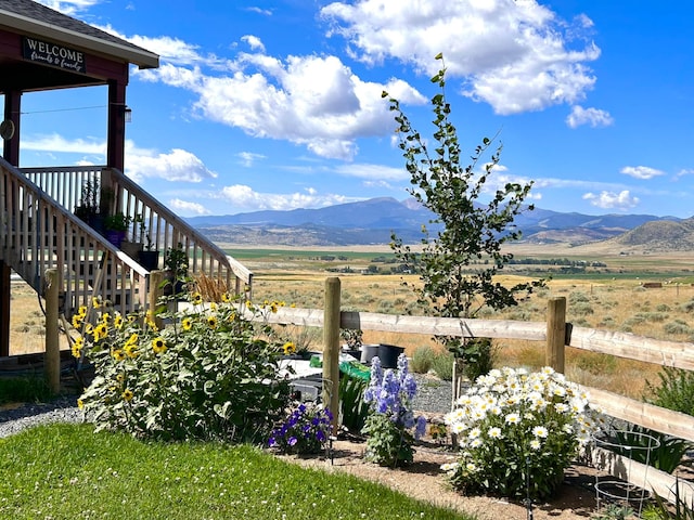 55 Mills Rd, Whitehall, MT 59759 - view of yard featuring a mountain view, stairway, and a rural view