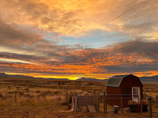 55 Mills Rd, Whitehall, MT 59759 - outdoor structure at dusk featuring a mountain view and a shed