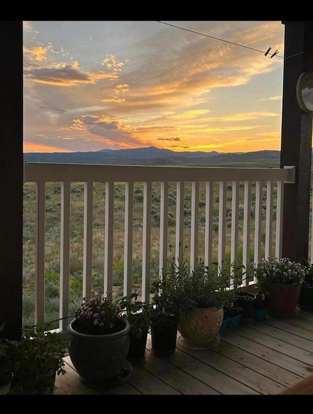 55 Mills Rd, Whitehall, MT 59759 - balcony at dusk with a mountain view