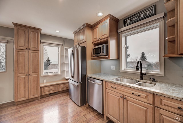 710 Joslyn St, Helena, MT 59601 - kitchen featuring stainless steel appliances, light stone counters, light wood-type flooring, and recessed lighting