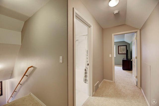 710 Joslyn St, Helena, MT 59601 - corridor featuring an upstairs landing, vaulted ceiling, and light carpet