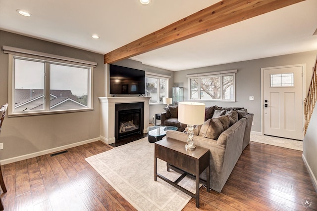 710 Joslyn St, Helena, MT 59601 - living room with a fireplace with flush hearth, dark wood finished floors, beamed ceiling, and recessed lighting