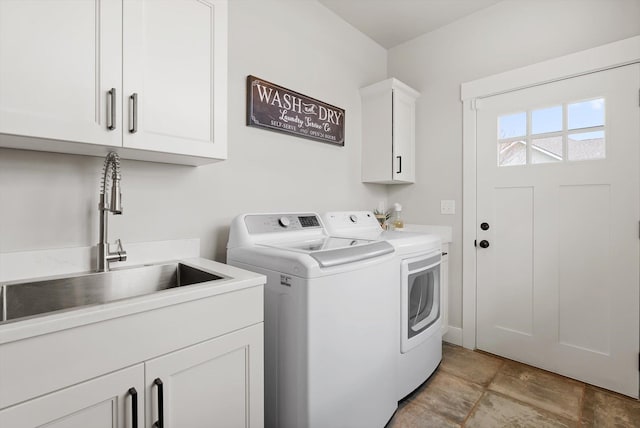 200 Ali Loop, Kalispell, MT 59901 - washroom featuring separate washer and dryer and cabinet space
