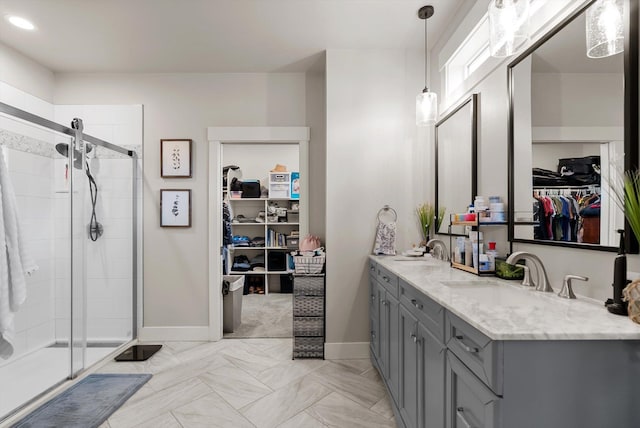 200 Ali Loop, Kalispell, MT 59901 - bathroom featuring a spacious closet, double vanity, and a shower stall
