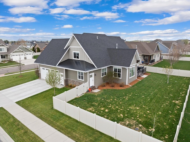 200 Ali Loop, Kalispell, MT 59901 - craftsman inspired home with board and batten siding, a residential view, concrete driveway, roof with shingles, and a garage