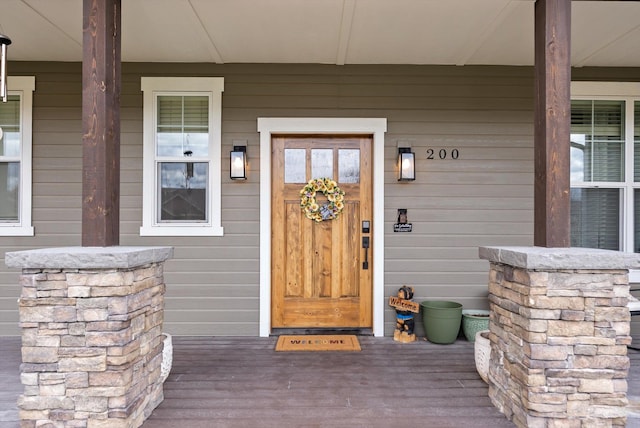 200 Ali Loop, Kalispell, MT 59901 - doorway to property featuring covered porch