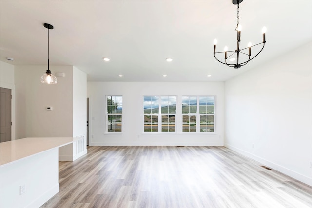 NHNLOT2 England Blvd, Missoula, MT 59808 - unfurnished living room featuring a chandelier, light wood-style floors, baseboards, and recessed lighting