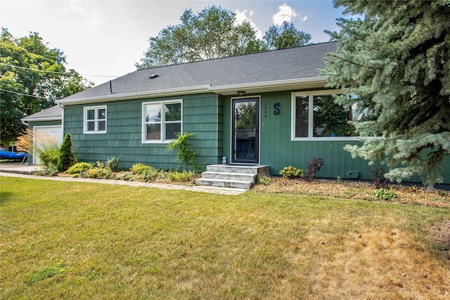 single story home with a front lawn and roof with shingles