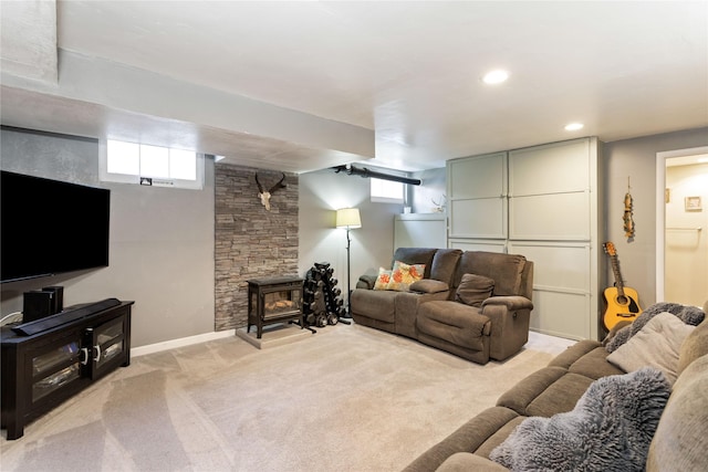 living area with light carpet, healthy amount of natural light, recessed lighting, and baseboards