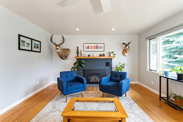 sitting room featuring wood finished floors, ceiling fan, baseboards, and recessed lighting