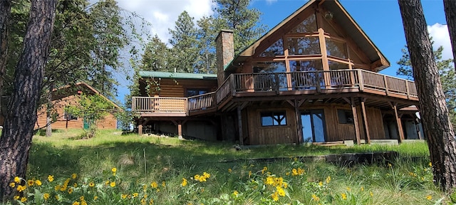 31611 Top Of The Rock Way W, Polson, MT 59860 - back of house with a wooden deck and a chimney