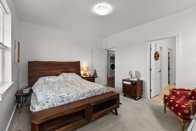 203 Kismet Ct, Hamilton, MT 59840 - bedroom featuring washer / clothes dryer, carpet flooring, and baseboards