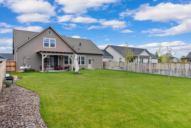 203 Kismet Ct, Hamilton, MT 59840 - back of property with a patio and roof with shingles