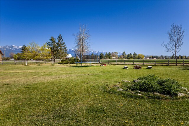 33766 W Shore Dr, Polson, MT 59860 - view of yard with a trampoline and a view of rural / pastoral area