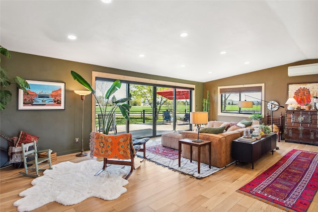33766 W Shore Dr, Polson, MT 59860 - living area featuring light wood-style floors, vaulted ceiling, recessed lighting, and an AC wall unit