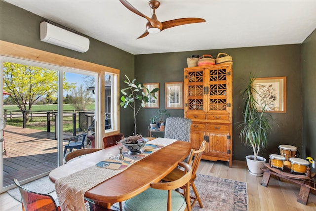 33766 W Shore Dr, Polson, MT 59860 - dining space featuring a wall unit AC, light wood-style floors, and ceiling fan