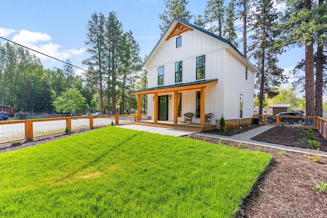 212 Water Way, Darby, MT 59829 - back of house featuring a porch