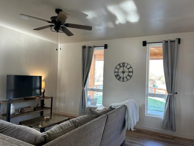 212 Water Way, Darby, MT 59829 - living area featuring wood finished floors, baseboards, and ceiling fan