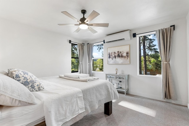 212 Water Way, Darby, MT 59829 - bedroom with a wall unit AC, carpet flooring, a ceiling fan, and baseboards