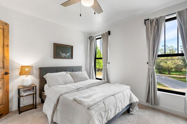 212 Water Way, Darby, MT 59829 - bedroom with light carpet, ceiling fan, and baseboards