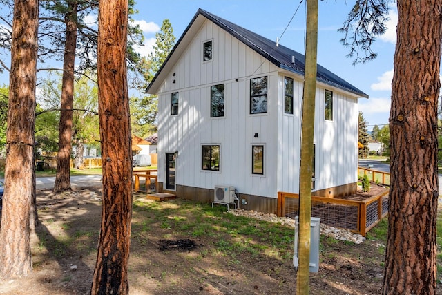 212 Water Way, Darby, MT 59829 - back of property featuring ac unit and board and batten siding
