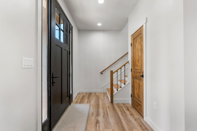 212 Water Way, Darby, MT 59829 - foyer with light wood-style floors, stairs, recessed lighting, and baseboards