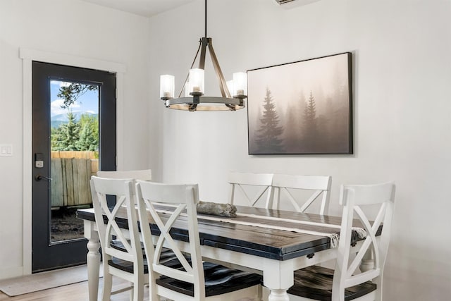 212 Water Way, Darby, MT 59829 - dining area featuring a chandelier and light wood-style flooring