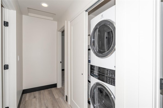 861 9th St W, Kalispell, MT 59901 - laundry area with stacked washer and clothes dryer and light wood-style floors