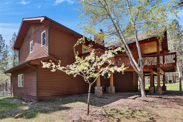 303 Wyant Ln, Hamilton, MT 59840 - view of home's exterior featuring a deck and a chimney