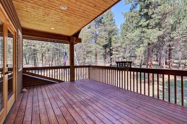 303 Wyant Ln, Hamilton, MT 59840 - wooden deck with view of wooded area