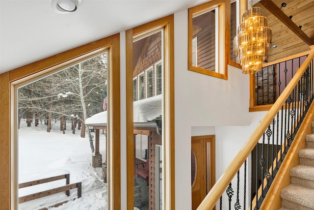 303 Wyant Ln, Hamilton, MT 59840 - stairs with a chandelier and plenty of natural light