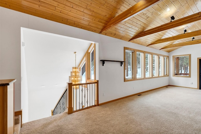 303 Wyant Ln, Hamilton, MT 59840 - unfurnished room featuring carpet flooring, wood ceiling, baseboards, and a chandelier