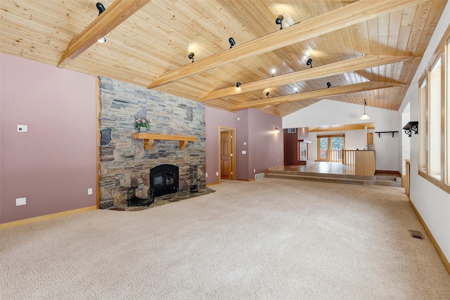 303 Wyant Ln, Hamilton, MT 59840 - unfurnished living room featuring baseboards, carpet flooring, wood ceiling, and a fireplace