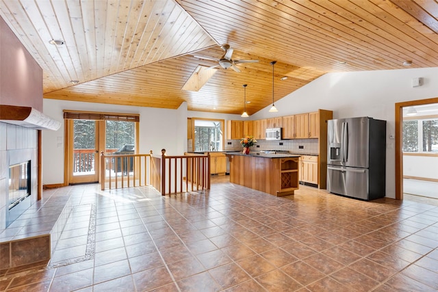 303 Wyant Ln, Hamilton, MT 59840 - kitchen featuring stainless steel appliances, a ceiling fan, a kitchen island, healthy amount of natural light, and wooden ceiling