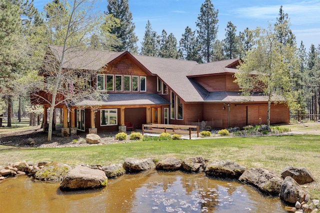 303 Wyant Ln, Hamilton, MT 59840 - back of house with a lawn and roof with shingles